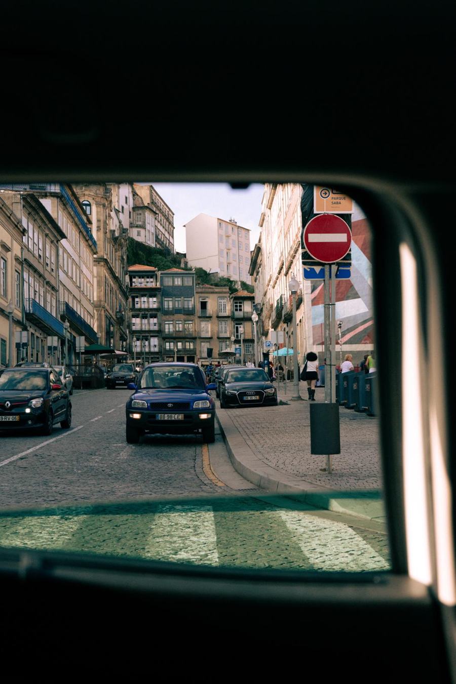 Porto street through a car window